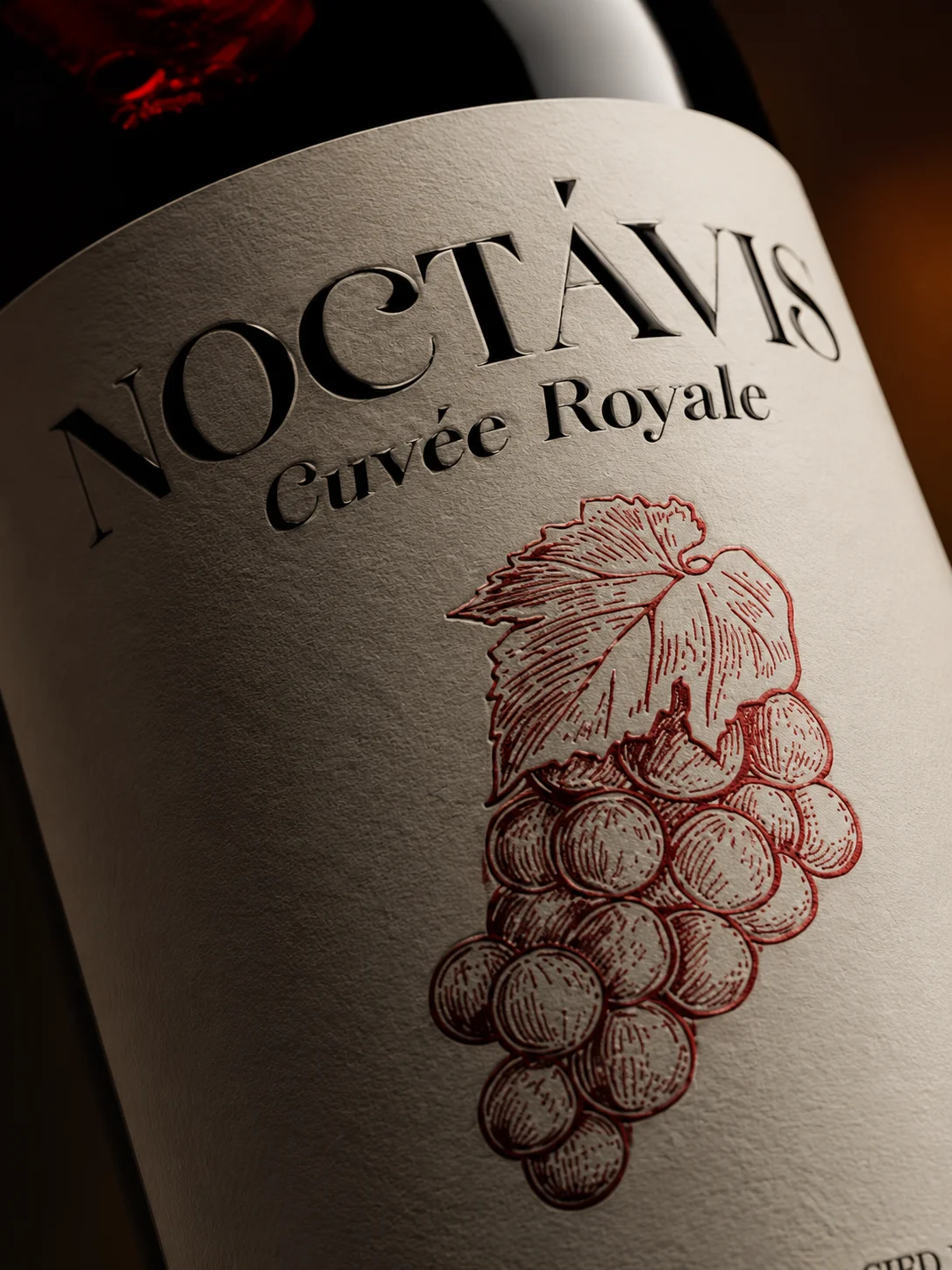 Close view of the Noctavis Cuvée Royale label with its red grape illustration